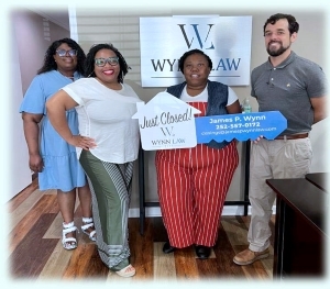 A row of people at Wynn Law for their house closing.