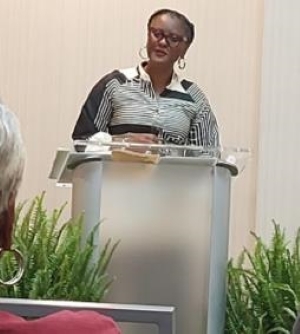 Lady speaking at the Annual Resident Council Retreat.