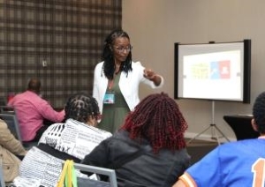 Woman showing a presentation to an audience.