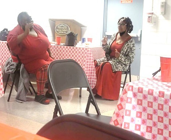 two women sitting at a table.