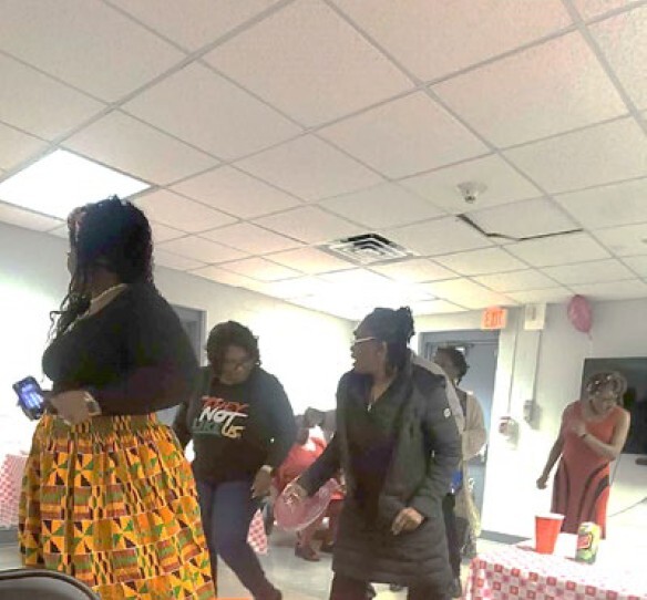 Three women dancing.