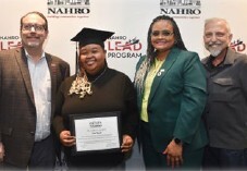 Erica Spruill holding her degree.