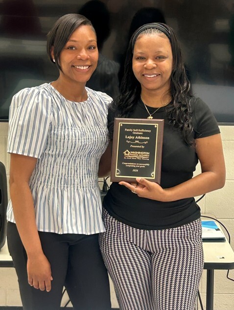 Lajoy holds her plaque and smiles for a picture with Shakiha Reid.