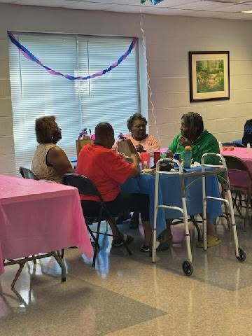 Guests gathered around a blue table