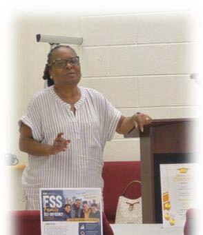 A woman speaking to others.