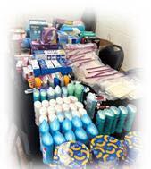 Various hygiene and food products stacked neatly on a table.