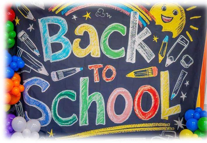 A backdrop with balloons and the words Back To School.