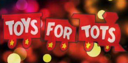 Toys for Tots is written across the cars of a train.