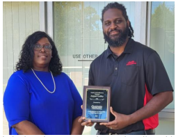 Kimberly Grimes presented Jamaal Godley with a plaque for completing the FSS program.