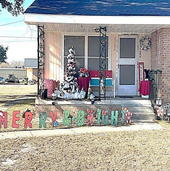 Front yard with holiday decorations viewed in the daylight.