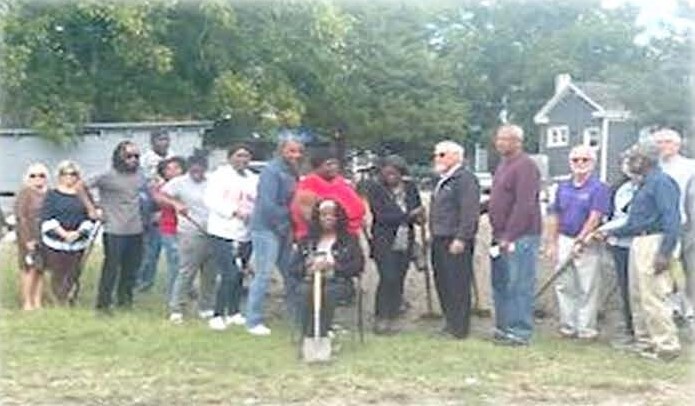 Group posing for the groundbreaking.