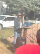 Woman at a podium speaking to an audience. 