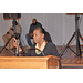 A woman speaking at the podium