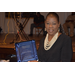 A woman holding a plaque