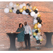 Posing for a picture under balloons