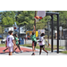 Kid in green jersey shooting the ball in the hoop