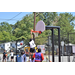 White jersey trying to knock ball away from hoop