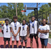 White jersey team wearing their medals next to the ED