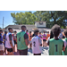 Players standing around in a circle listening to the referee