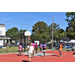 A WHA employee is walking across the court