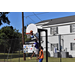 Another young man in a purple jersey making a layup