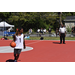 Young man in white jersey bouncing the ball