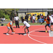 Orange jersey's teammate tries to get closer to receive a pass