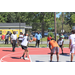 Young man in a white jersey about to shoot the ball from the free throw line