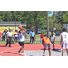 Young man in a white jersey shooting the ball from the free throw line