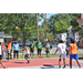 Guy in orange jersey shooting a 3 pointer