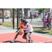 Player trying hard to keep the other player from getting to the basket