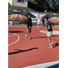 Two males practicing on the court