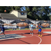 Young man in a dark blue shirt about to shoot the ball