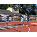 Young guy in a dark blue shirt shooting the ball from the 3-point line
