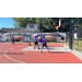 A player in a green jersey jumps to make his shot