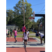 A player wearing pink jumped to make a shot