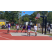 Players prepare to get the ball after the free throw is shot