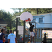 Young man in black dunking the ball