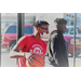 Young man in a red shirt holding the ball