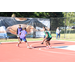 Kid in purple being guarded by kid in green