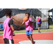 Kid in pink passing the ball to his teammate