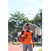 Orange jersey and dark blue shirt holding the ball