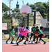 Three pink jerseys and three green jerseys playing ball