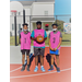 Three kids from the pink team holding the ball