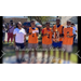 The ED standing beside four young men smiling and holding trophies.