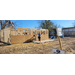 Construction workers inspecting the framing of the house.