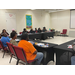 An audience sitting at tables.