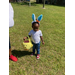 A young child wearing Easter bunny ears.