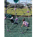 Two children play on playground equipment.