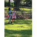 Two young children hunt for eggs.